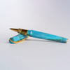 Visconti Mirage Mythos Athena rollerball pen with detailed gold and blue design, elegant writing instrument on a white background.