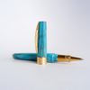 Visconti Mirage Mythos Athena rollerball pen with intricate design and gold accents, displayed on a neutral background.