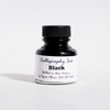 Black bottled calligraphy ink by Papier Plume, showing a glass bottle with ink and calligraphy pen on a white background.