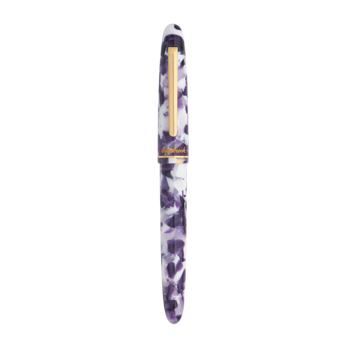 Esterbrook Estie Bestie fountain pen with a closed purple barrel and gold accents, showcasing a stylish writing instrument.