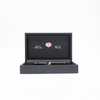 Aurora Optima black fountain pen with gold trim, featuring a sleek body and elegant design, close-up of pen tip and cap.