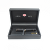 Aurora Optima black fountain pen with gold trim, elegant writing instrument with sleek design and premium craftsmanship.