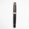 Aurora Optima black fountain pen with gold trim, featuring a sleek design and smooth ink flow for elegant writing.