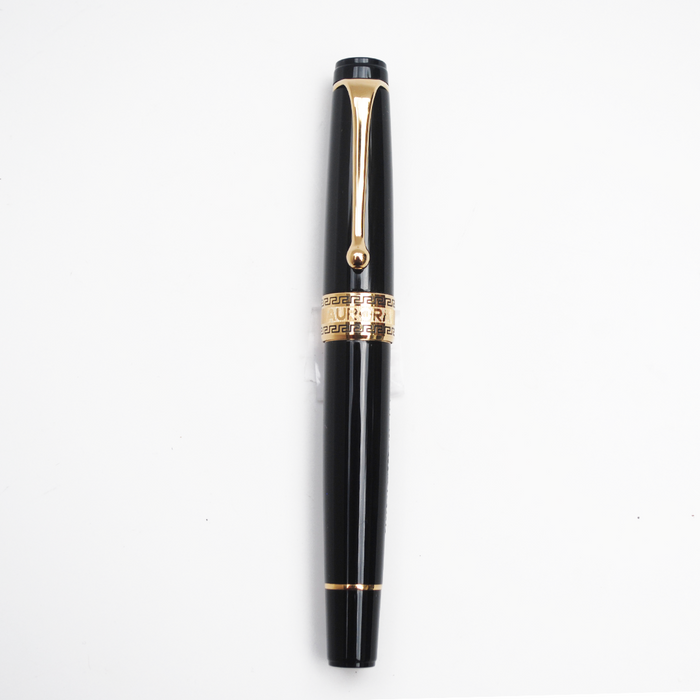 Aurora Optima black fountain pen with gold trim, featuring a sleek design and smooth ink flow for elegant writing.