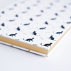 Black Rossi cat journal with a sleek cover, featuring feline artwork and lined pages for notes and journaling.