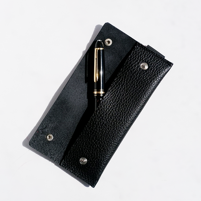 Long black San Lorenzo pen case with a sleek, minimalist design for storing pens and writing instruments.