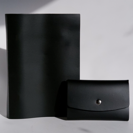Papier Plume Swatch Book set with black cover, displaying color samples and pages for painting or design projects.