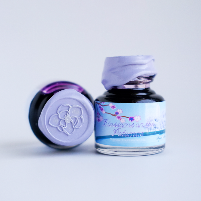 Papier Plume fountain pen shimmer ink titled "Blossoms on the Potomac" with floral design on the bottle.
