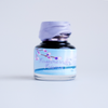 Papier Plume DC Pen Show blossoming fountain pen shimmer ink in a glass bottle with vibrant floral design.