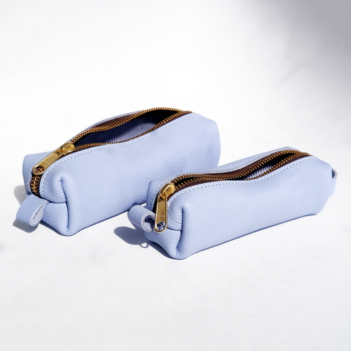 Blue San Lorenzo pen case with zipper closure, showcasing a sleek, compact design for storing pens and small stationery items.