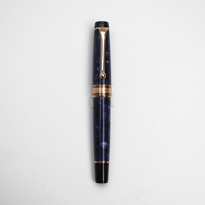 Aurora Optima Violet Auroraloide fountain pen with rose gold trim, blue body, and elegant design.