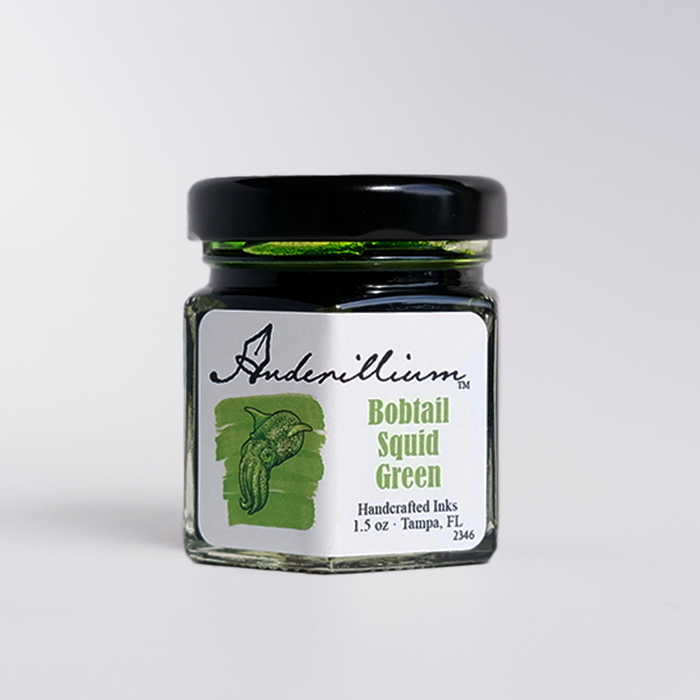 Anderillium Bobtail Squid Green fountain pen ink in a glass bottle with vibrant green ink visible inside.