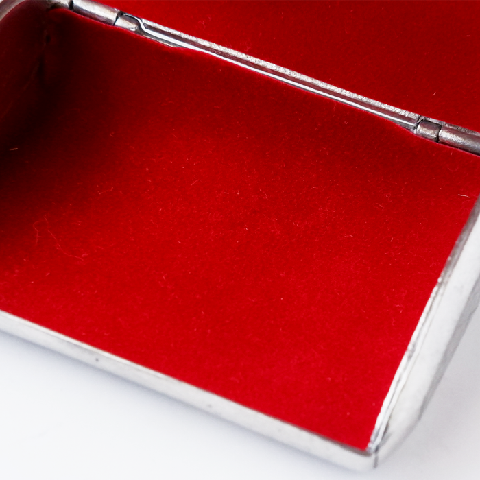 Le Potier D'etain card holder in metal with engraved design, compact and stylish for holding credit cards and IDs.