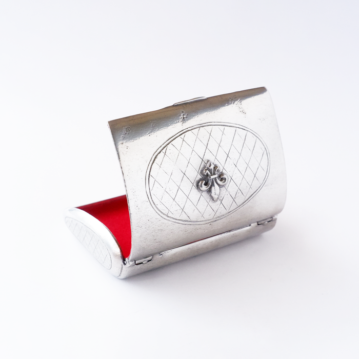 Le Potier D'etain card holder in metal with a sleek, compact design for holding credit cards and IDs.
