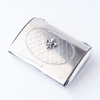 Le Potier D'etain card holder with intricate metal design, compact and stylish for holding credit cards and IDs.
