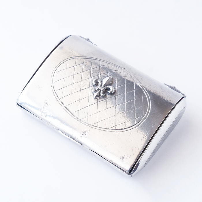 Le Potier D'etain card holder with intricate metal design, compact and stylish for holding credit cards and IDs.