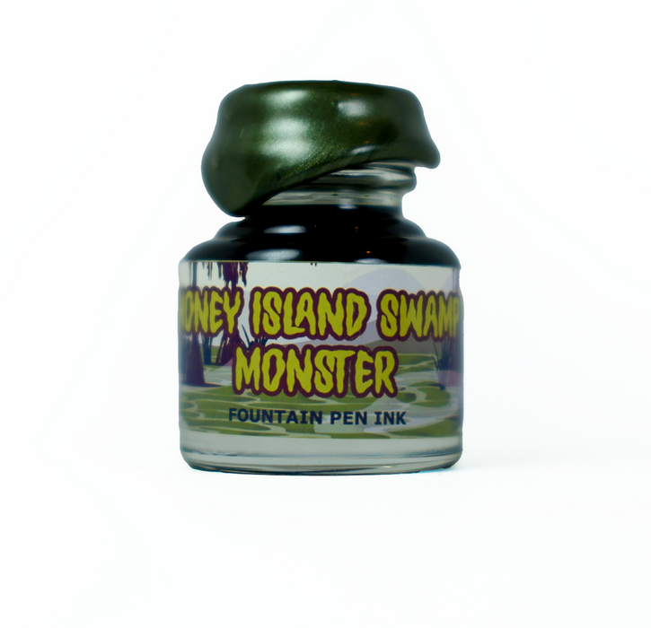 Papier Plume Honey Island Swamp Monster fountain pen ink bottle, limited edition, with dark, mossy green and swamp-inspired colors.