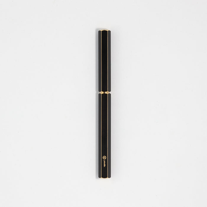 Y Studio Classic Revolve black rollerball pen with sleek design and polished brass finish, ideal for writing and office use