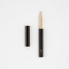 Y Studio Classic Revolve black rollerball pen with sleek design and metallic brassing, shown on a neutral background.