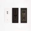 Y Studio Classic Revolve black rollerball pen with metallic finish, displayed in its packaging.