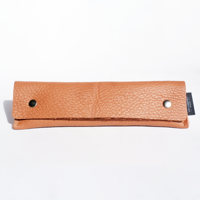 Long brown San Lorenzo pen case with a sleek, smooth exterior and secure zipper closure.