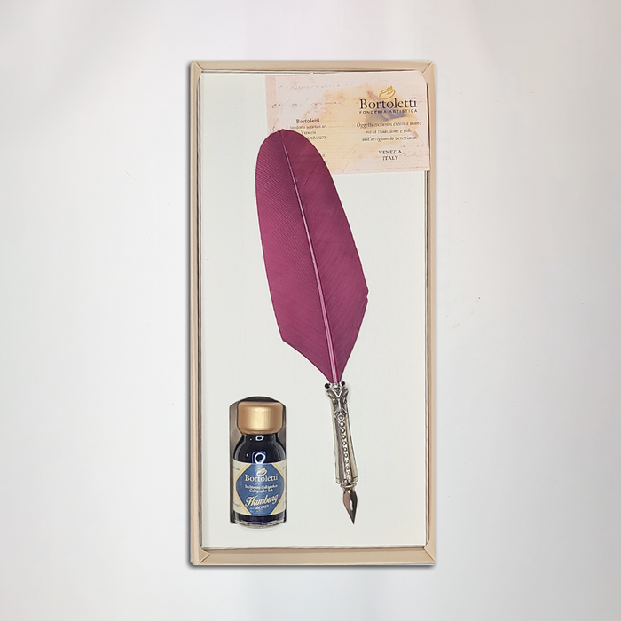Bortoletti glass dipping pen set with burgundy-colored feather-shaped pens for calligraphy and artistic writing.