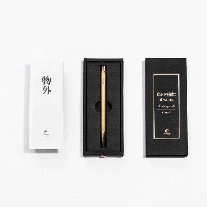 Y Studio STAT-14 Classic brass mechanical sketching pencil with textured grip and sleek design.