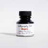 Papier Plume bottled calligraphy ink in sepia, showing a glass ink bottle with a black cap and a calligraphy pen.