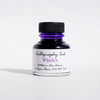 Violet bottled calligraphy ink by Papier Plume in a glass container with a black screw cap, designed for artistic writing.