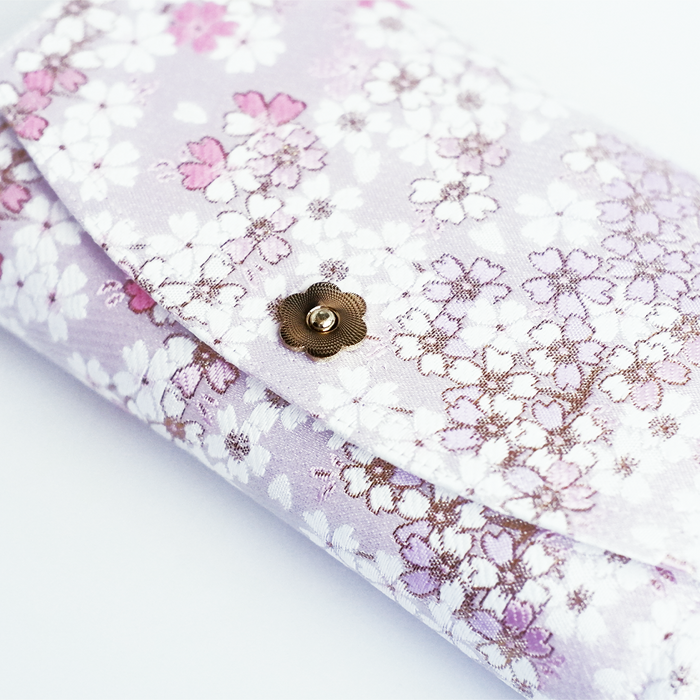 Iridescent Cathay Bloom pen case with floral design, featuring a sleek rectangular shape and zipper closure.