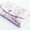 Iridescent Cathay Bloom pen case with a shimmering floral design, made for storing and protecting writing instruments.