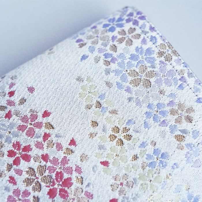 Cathay Snowlit Bloom pen case with floral design, made of durable material, featuring a zipper closure and compact size for stationery storage.