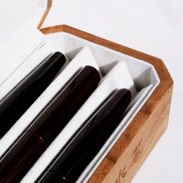 Cathay wooden pen box with a smooth finish and hinged lid, designed for elegant storage of writing instruments.