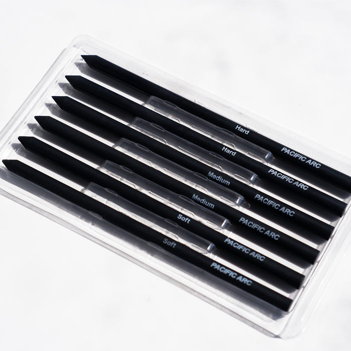 Pacific Arc charcoal lead in 5.6mm diameter, dark gray pencil lead for drawing and writing, displayed on a neutral background.