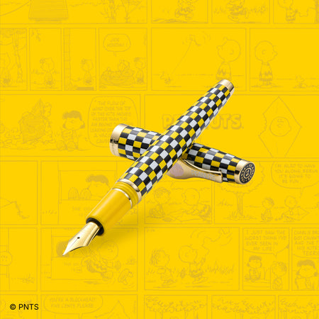 Esterbrook Charlie Brown Estie fountain pen with comic-style background, featuring a classic Peanuts character design.