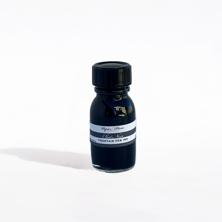 Papier Plume Chat Noir fountain pen ink bottle with black ink, labeled with a black cat illustration, on a white background.