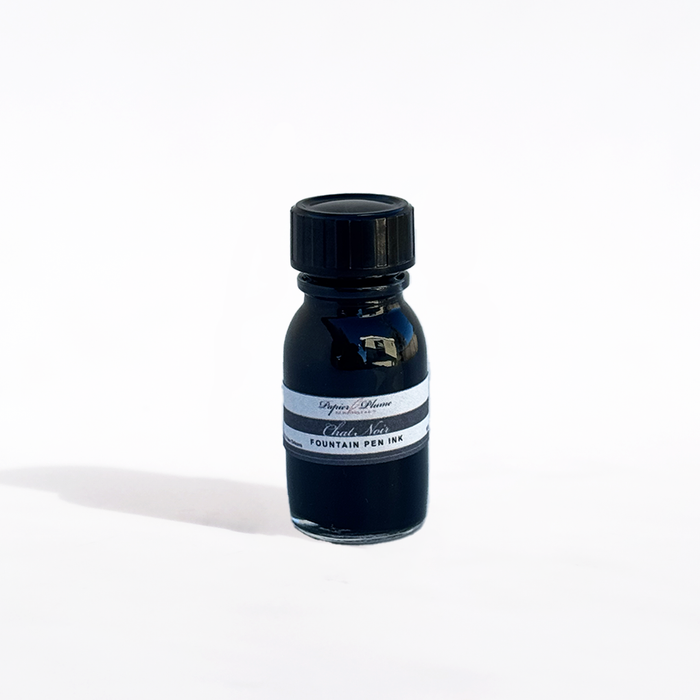 Papier Plume Chat Noir fountain pen ink bottle with black ink, labeled with a black cat illustration, on a white background.