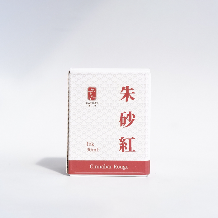 Bottle of Cathay Cinnabar Rouge fountain pen ink with vibrant red-orange color and elegant label design.