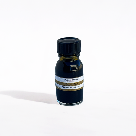 Bottle of Papier Plume fountain pen ink in vibrant Citron Vert green with a glass ink container and label visible.