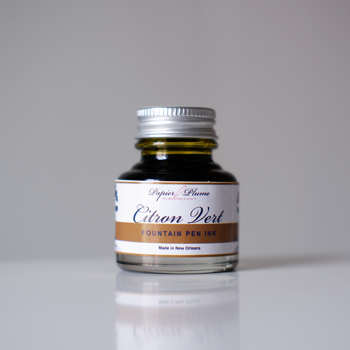 Papier Plume fountain pen ink set of 12 bottles, including vibrant citron vert color, 30ml each for writing and calligraphy.