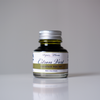 Papier Plume fountain pen ink in vibrant citron vert green, showcasing the bright, smooth ink in a glass bottle.