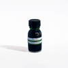 Bottle of Papier Plume Colibri fountain pen ink with vibrant blue ink visible inside the glass bottle.