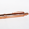 Copper Jean Pierre Lepine ballpoint pen by Papier Plume with a sleek metallic finish and streamlined design.