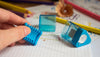 KUM Correc Tri M1 pencil sharpener and eraser combo, compact design with sharpener blades and eraser surface for convenient use.
