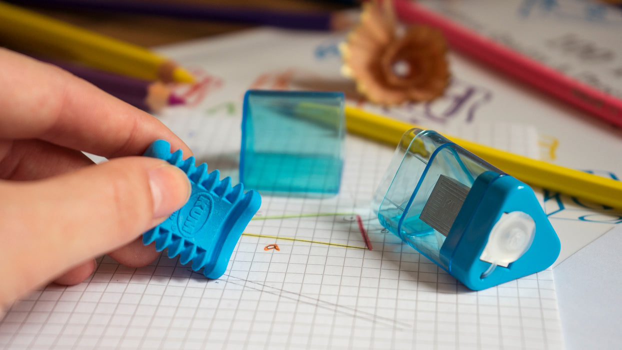 KUM Correc Tri M1 pencil sharpener and eraser combo, compact design with sharpener blades and eraser surface for convenient use.