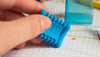 KUM Softi Tri Pop triangle eraser in pastel colors, designed for precise and comfortable pencil erasing on paper.