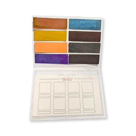 Peerless Watercolors portable palette with custom travel-sized watercolor pans and mixing area, ideal for on-the-go painting.