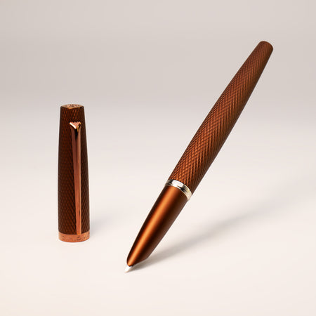 Diplomat Viper brown fountain pen with sleek design and gold accents, shown with the cap removed revealing the nib.