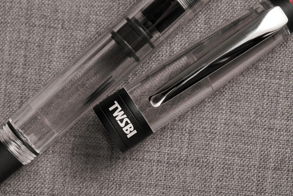 Black Twsbi Diamond 580AL R fountain pen with gold accents and smooth clip, showcasing elegant design and detailed craftsmanship.