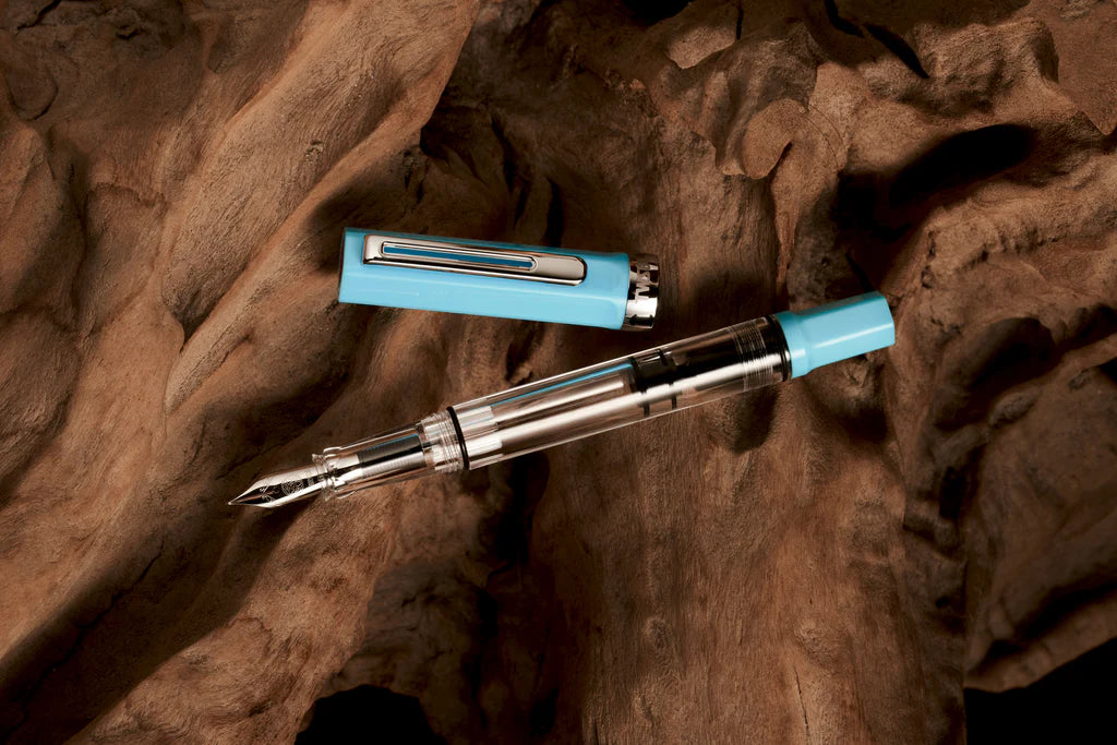 Twsbi Eco Sky Blue fountain pen with smooth barrel and shiny metal accents, showcasing a sleek and vibrant writing instrument.